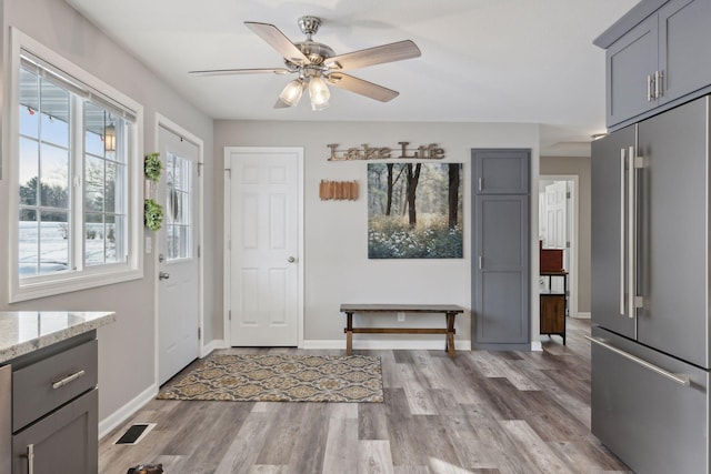 interior space featuring ceiling fan and light hardwood / wood-style flooring