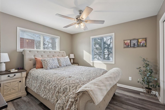 bedroom with dark hardwood / wood-style flooring and ceiling fan