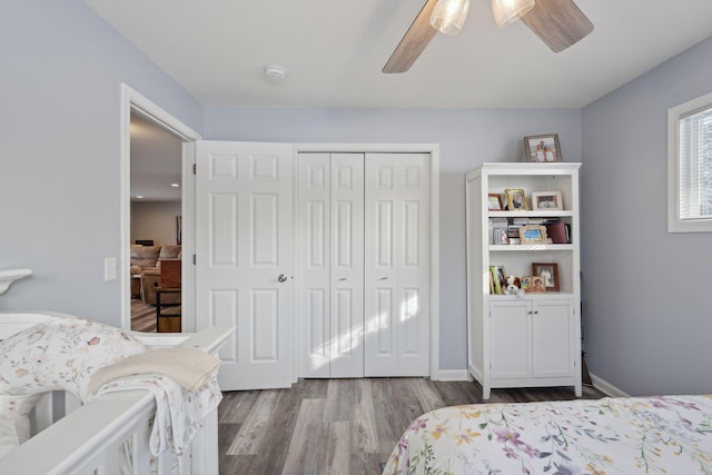 bedroom featuring a closet, ceiling fan, and light hardwood / wood-style flooring