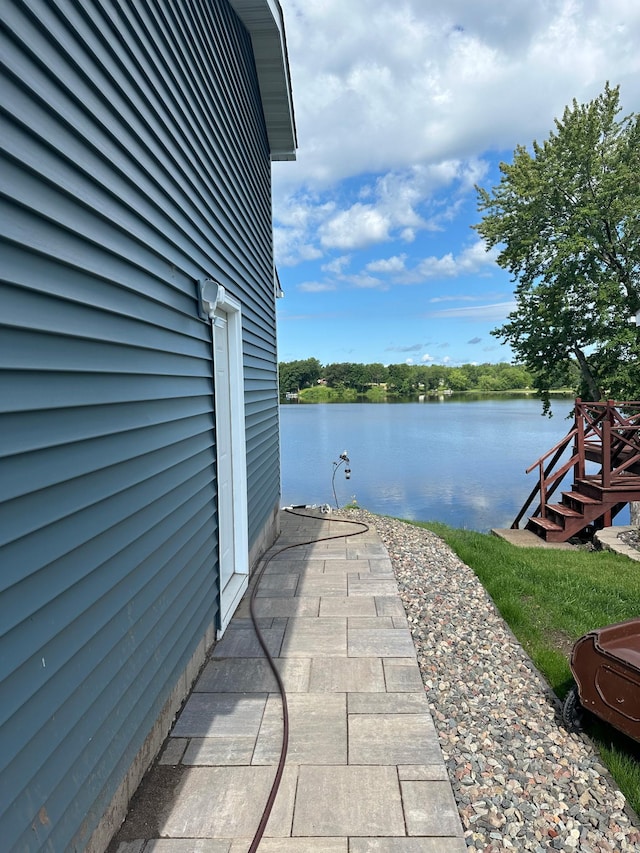 view of patio / terrace with a water view