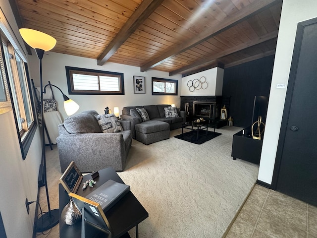 living room featuring wooden ceiling, beam ceiling, and a fireplace