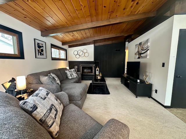 carpeted living room featuring wood ceiling, beam ceiling, and a brick fireplace