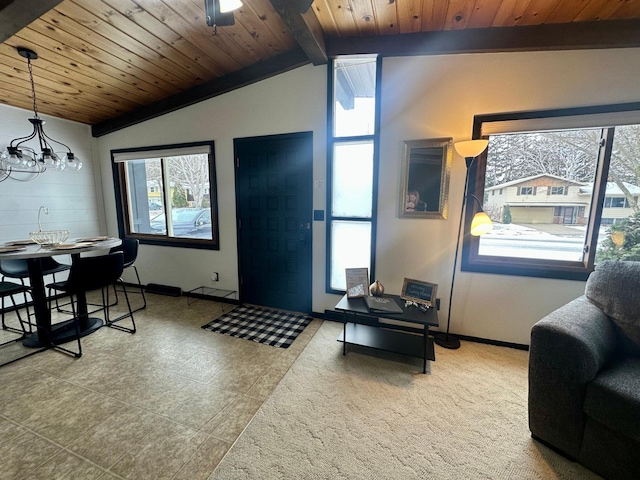 living room featuring vaulted ceiling with beams, wooden ceiling, and a chandelier