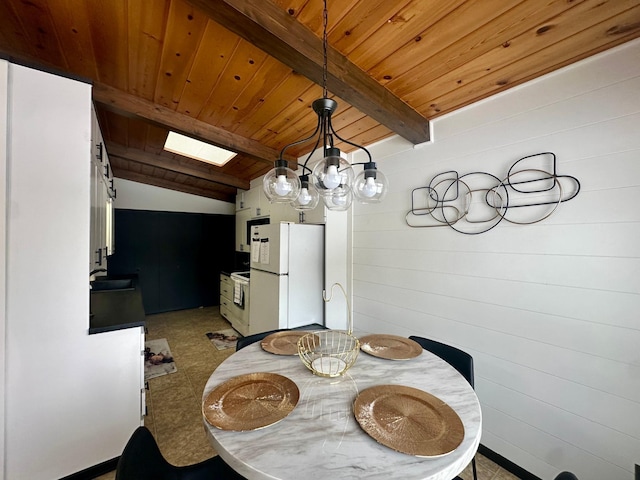 dining area featuring wooden ceiling and vaulted ceiling with skylight