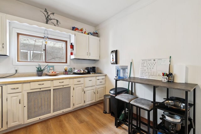 kitchen with light wood-style floors and light countertops