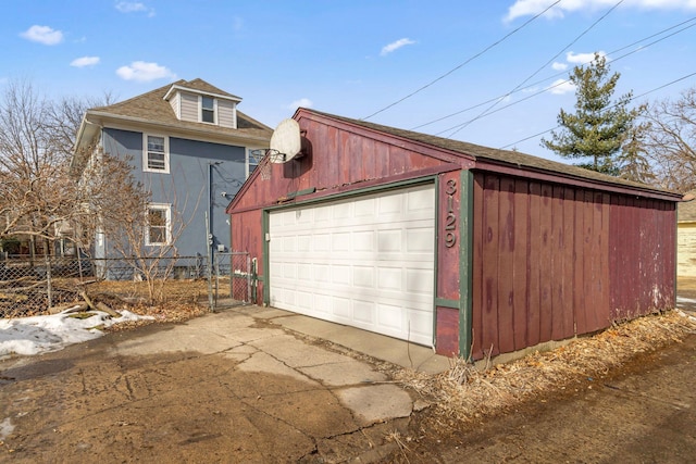 detached garage with fence