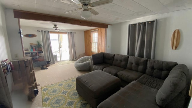 carpeted living room featuring ceiling fan