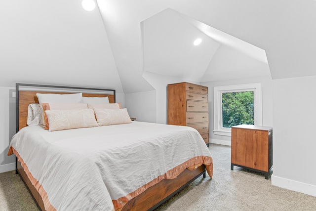 bedroom with light carpet, recessed lighting, baseboards, and lofted ceiling