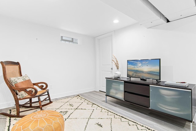 sitting room with recessed lighting, light wood-type flooring, and baseboards