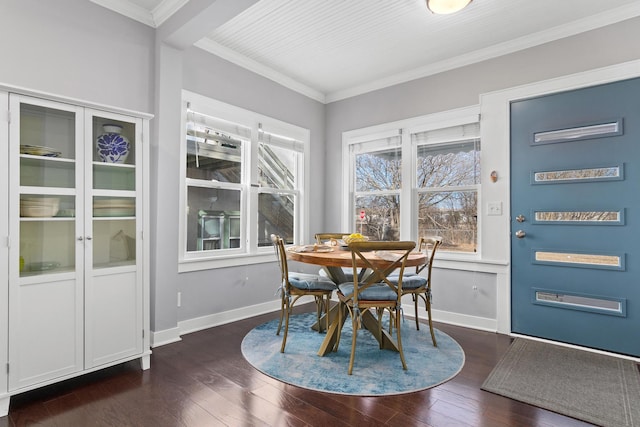 dining area with baseboards, dark wood-style flooring, and crown molding