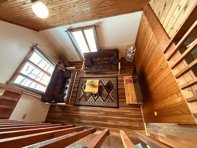 stairs featuring wood ceiling and wooden walls