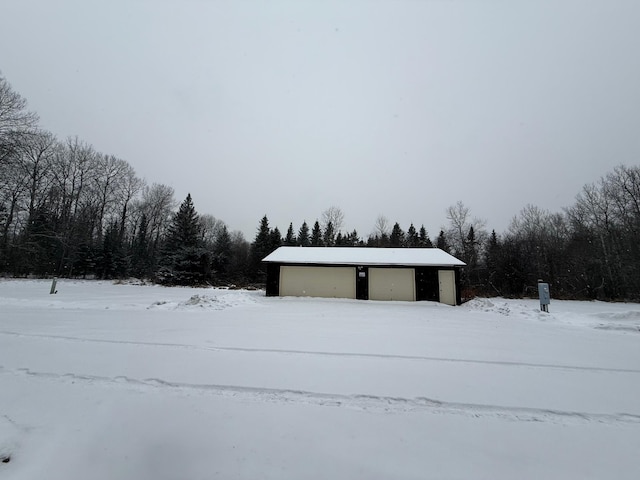 view of snow covered garage