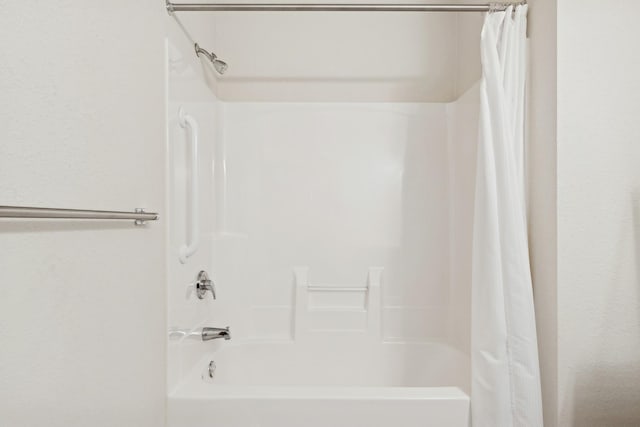 full bath with shower / bath combination with curtain