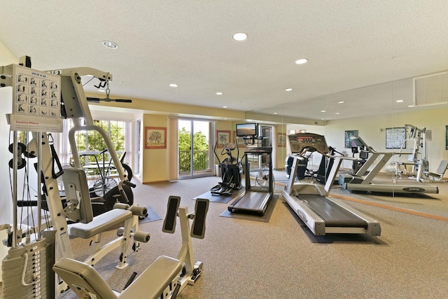 workout area with recessed lighting and a textured ceiling