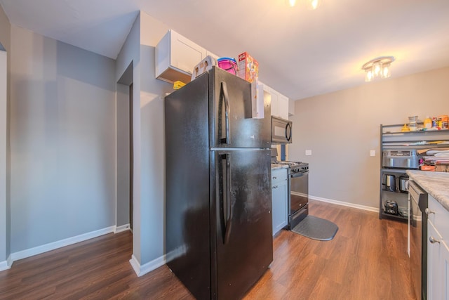 kitchen featuring white cabinetry, dark wood-type flooring, and black appliances