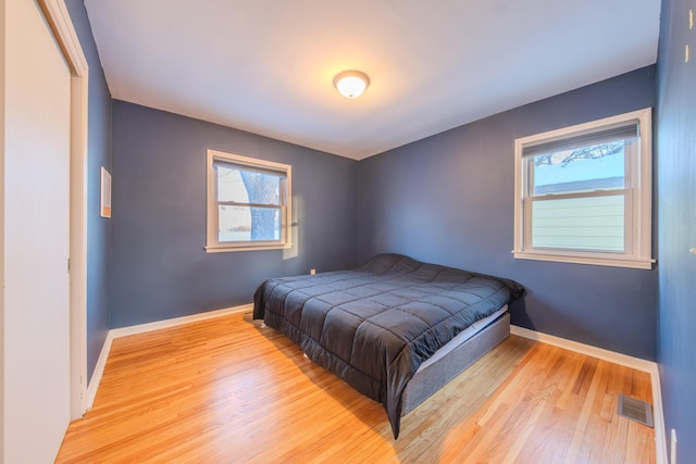 bedroom with light hardwood / wood-style floors