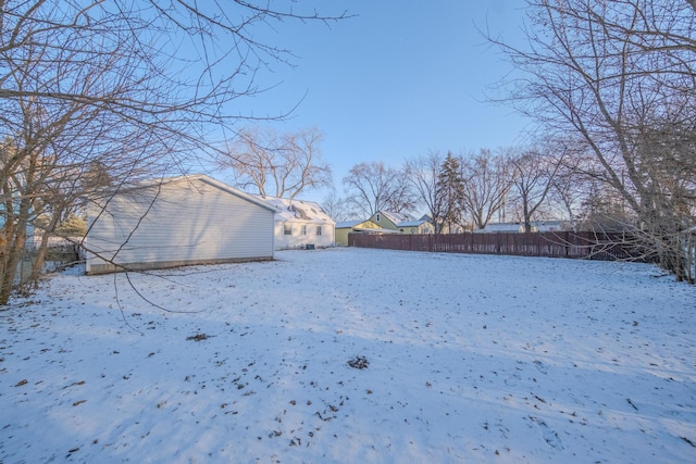 view of yard layered in snow