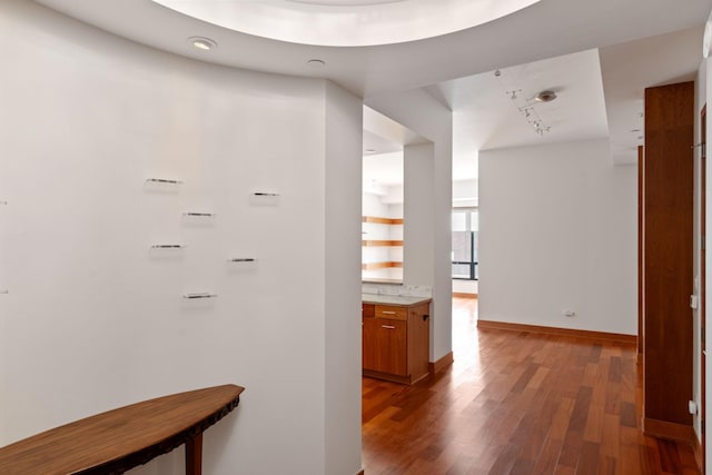 corridor featuring dark hardwood / wood-style floors