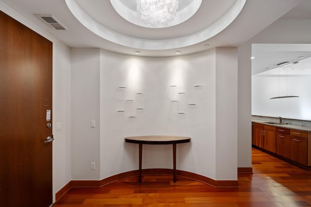 interior space with hardwood / wood-style floors and sink