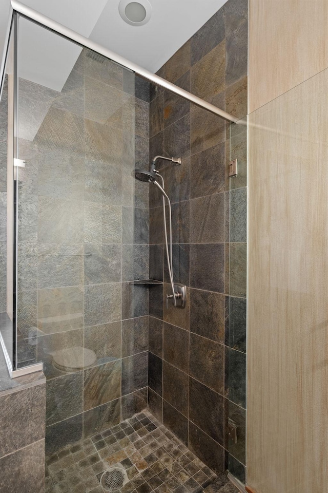 bathroom with a tile shower