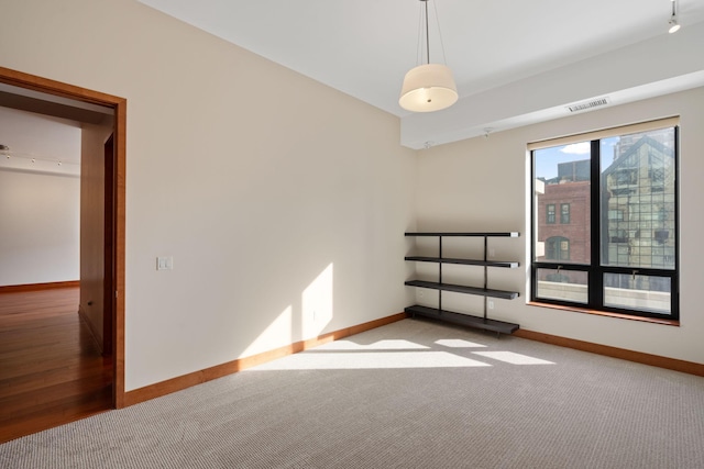 empty room with light colored carpet