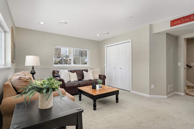 living room with recessed lighting, light colored carpet, visible vents, stairway, and baseboards