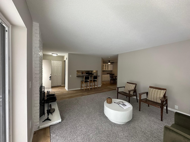 living room with hardwood / wood-style flooring and a textured ceiling