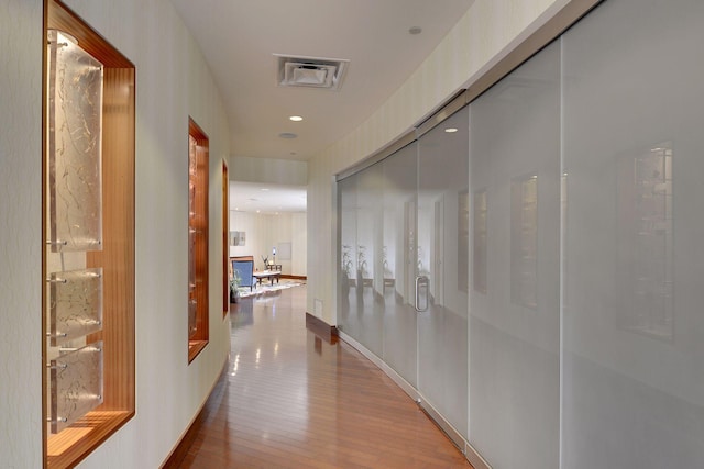 corridor featuring hardwood / wood-style floors