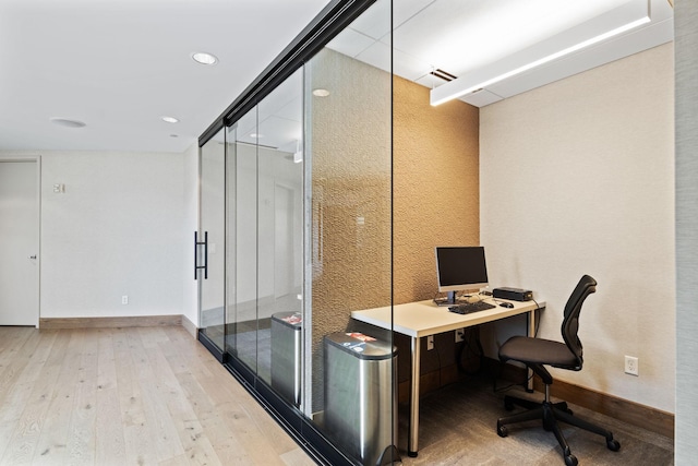 office with light hardwood / wood-style flooring