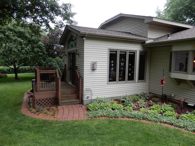 view of side of home featuring a lawn