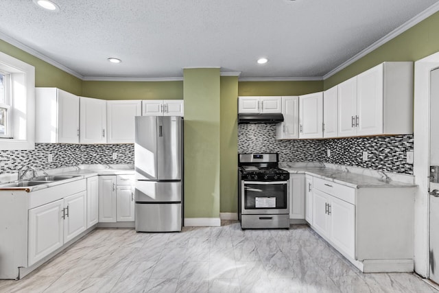 kitchen with sink, stainless steel appliances, white cabinetry, and crown molding