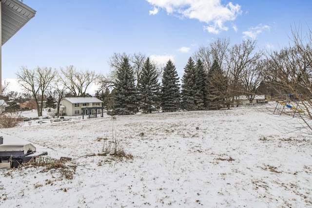 view of yard layered in snow