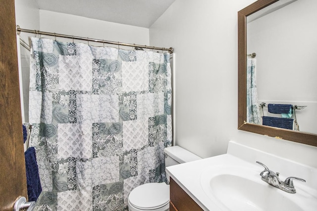 full bathroom with toilet, curtained shower, and vanity