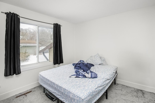 carpeted bedroom with baseboards