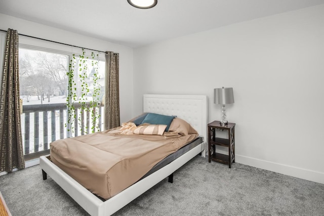 carpeted bedroom with baseboards