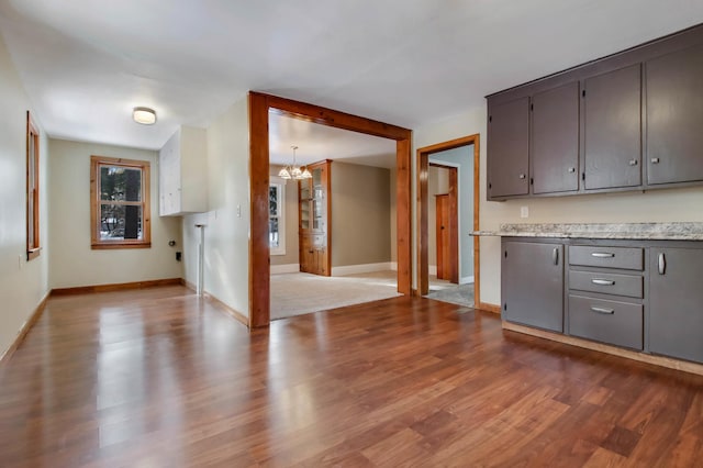 kitchen featuring an inviting chandelier and light wood-type flooring