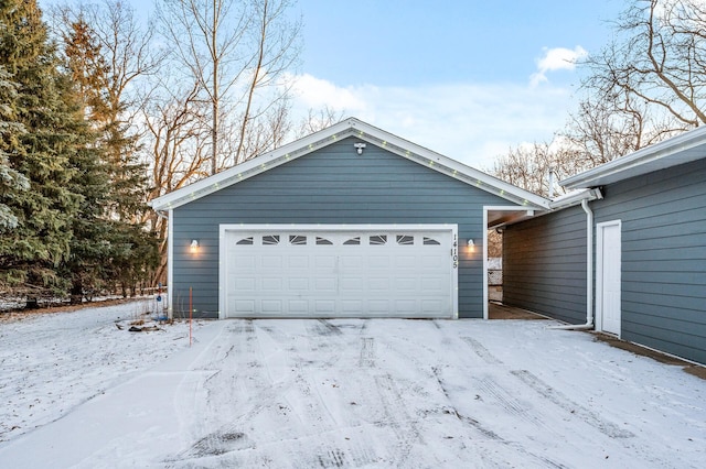 view of snow covered garage