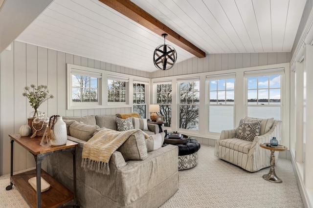 sunroom with lofted ceiling with beams, a water view, and wood ceiling