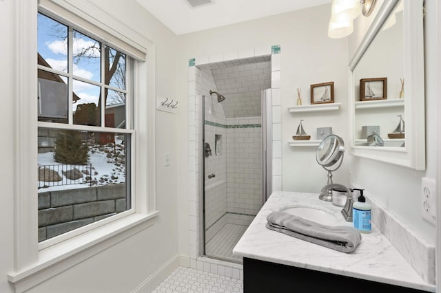 bathroom featuring an enclosed shower and vanity