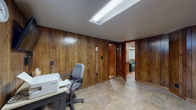 home office featuring wood walls