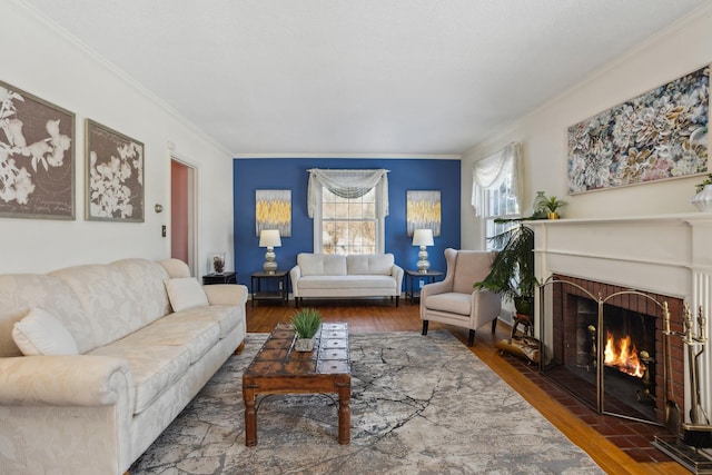 living room featuring ornamental molding, dark wood-style flooring, and a fireplace