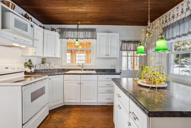 kitchen with wood ceiling, white appliances, white cabinets, and a sink