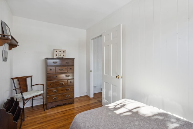 bedroom with dark wood-type flooring