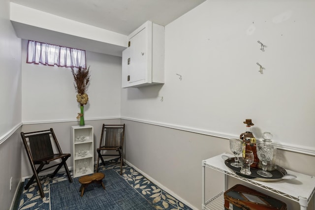 sitting room featuring baseboards