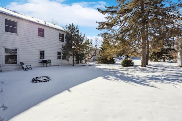 view of yard layered in snow