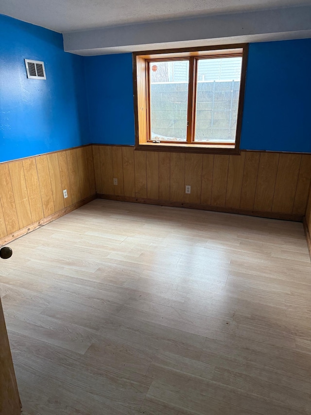 unfurnished room featuring light wood-type flooring