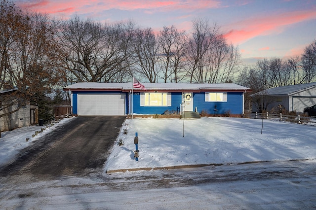 single story home with a garage