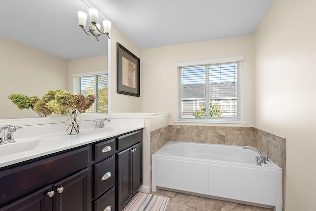 bathroom featuring vanity and a tub