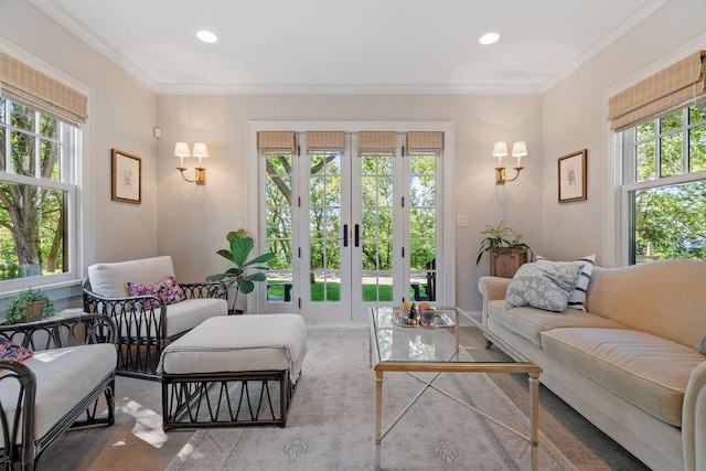 living room with ornamental molding and french doors