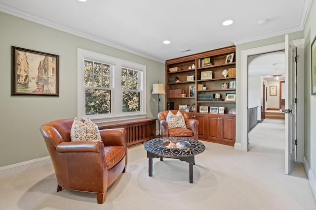 living area featuring radiator, light colored carpet, and ornamental molding